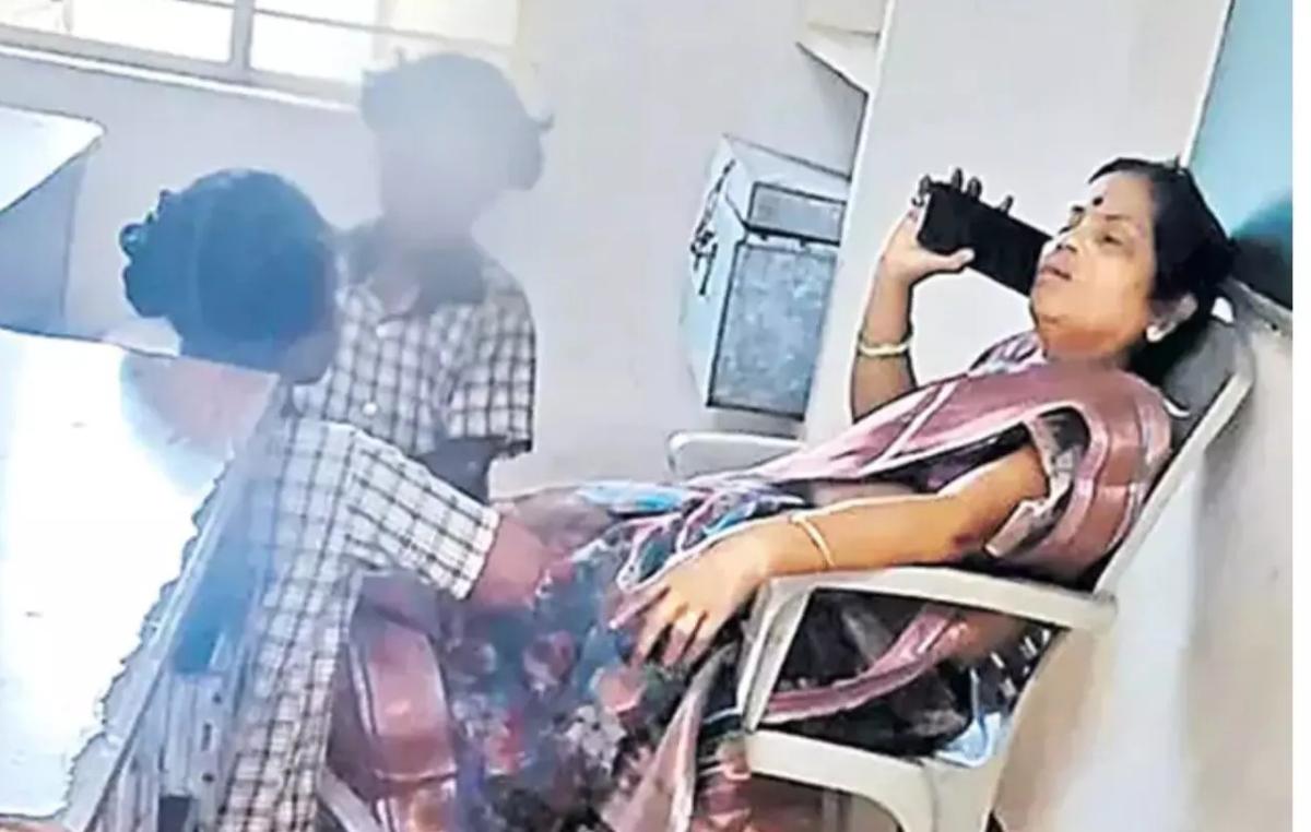 ஆந்திரா அரசுப் பள்ளியில் அதிர்ச்சி: நாற்காலியில் சாய்ந்தபடி செல்போனில் பேசிய ஆசிரியை, கால்களைப் பிடித்துவிட்ட மாணவிகள் – சஸ்பெண்ட்!